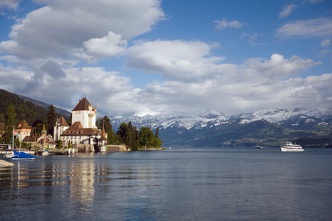 Boat arrivinig at Castle Oberhofen at Lake Thun, Oberhofen, Bernese Oberland (highlands), Canton of Bern, Switzerland