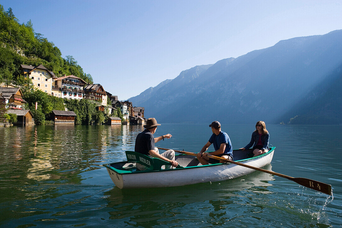 People in a rowboat on Lake Hallstatt, Hallstatt, Salzkammergut, Upper Austria, Austria