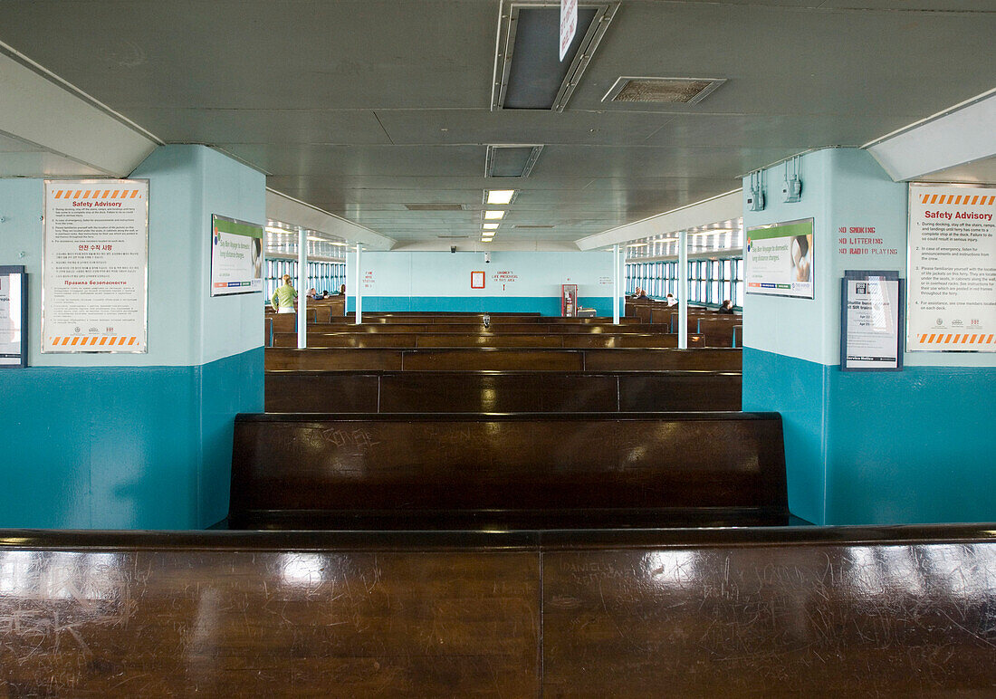 Empty benches inside the Staten Island Ferry, Manhattan, New York, USA