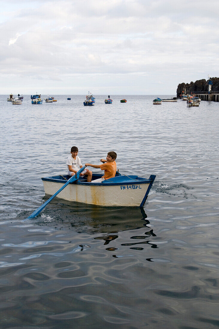 Children in boat, Camara de Lobos, Madeira, Portugal, Spain