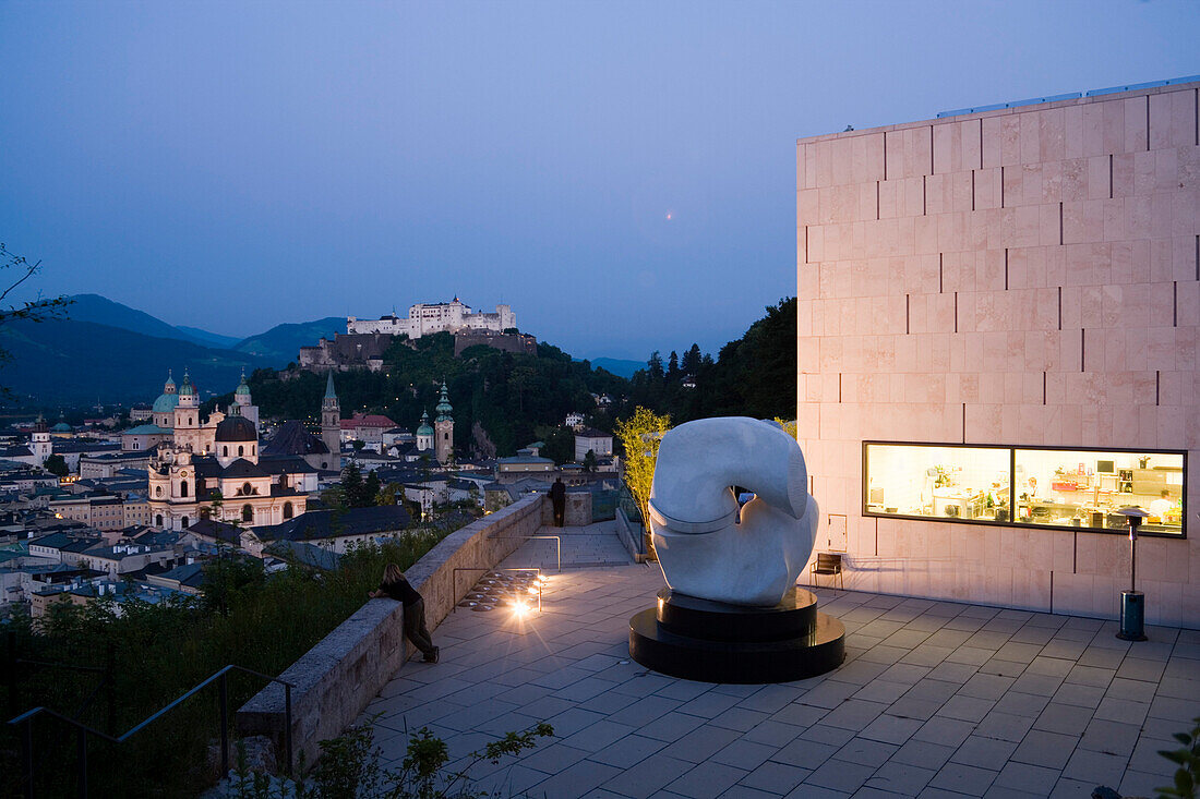 View from Museum of Modern Art over Collegiate Church, Franciscan Church and St. Peter's Archabbey to Hohensalzburg Fortress in the evening, Salzburg, Austria, Since 1996 the historic centre of the city is part of the UNESCO World Heritage Site