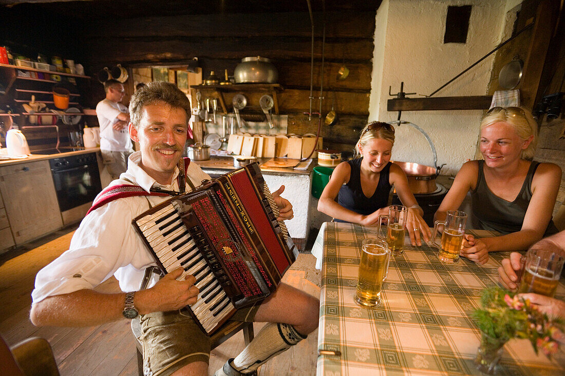 Man playing accordion at Bichlalm 1731 m, Grossarl Valley, Salzburg, Austria