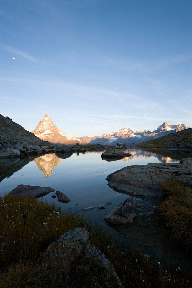 East side (Hörnligrat) of Matterhorn (4478 m) reflected in Riffelsee, Zermatt, Valais, Switzerland