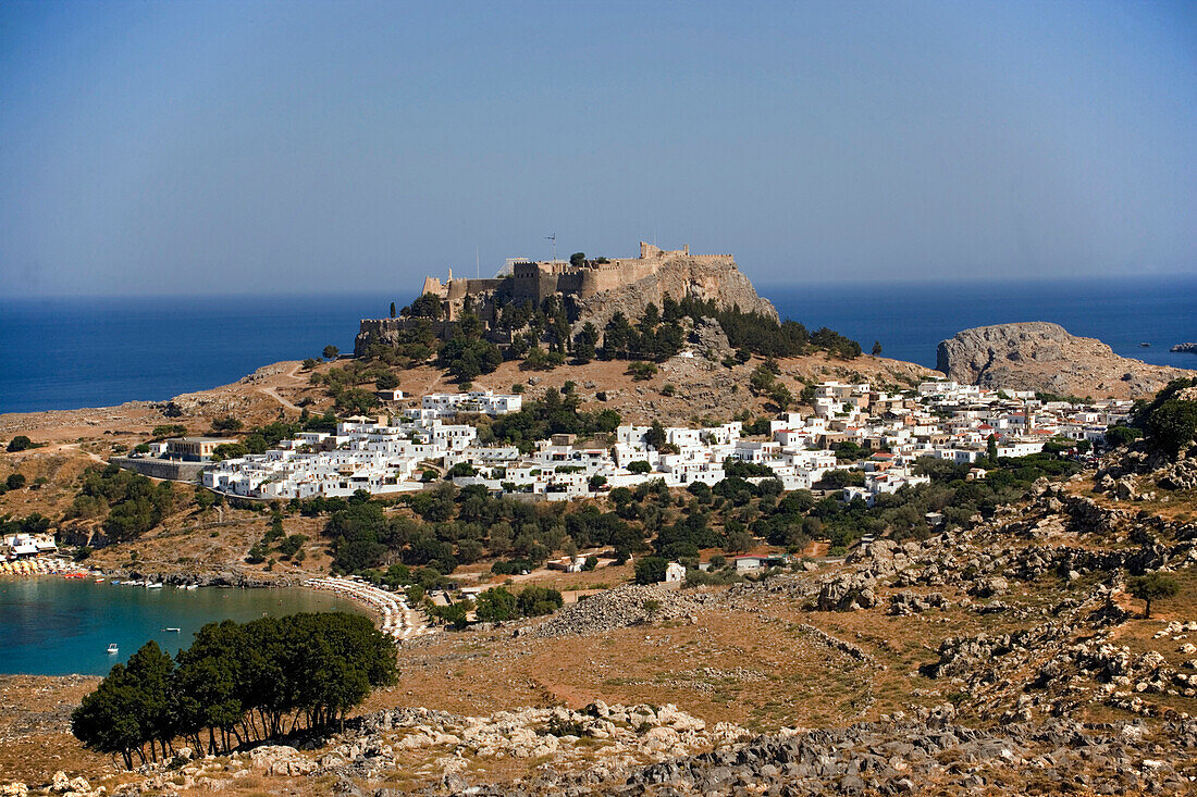 Elevated view of Lindos Bay and town with Acropolis, Lindos, Rhodes, Greece