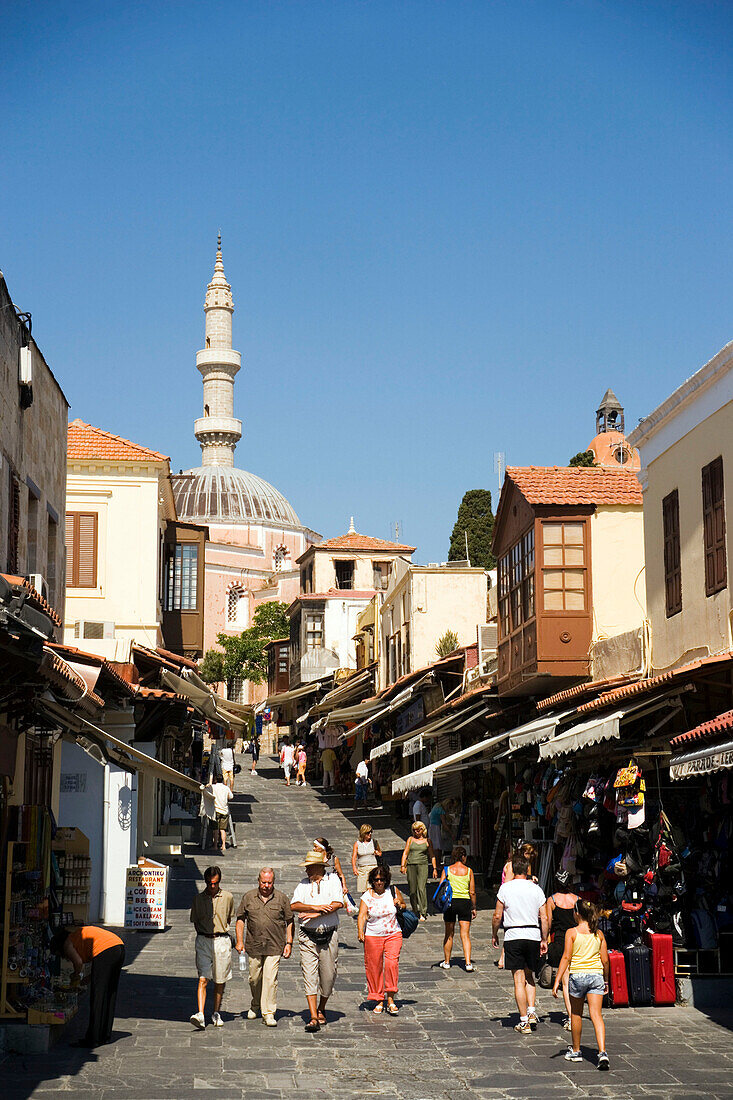 View along shopping street Odos Sokratous, Mosque of Suleyman in background, Rhodes Town, Rhodes, Greece, (Since 1988 part of the UNESCO World Heritage Site)