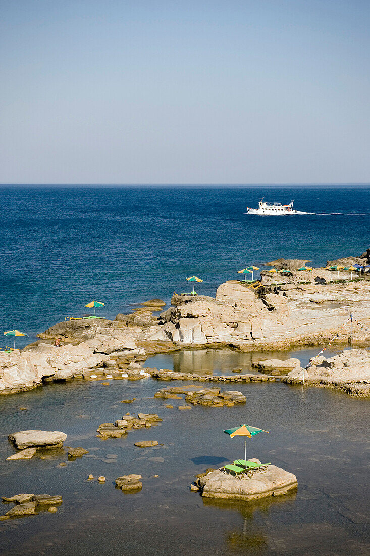 View over Nikolas Beach to boats on Aegean Sea, Rhodes Town, Rhodes, Greece