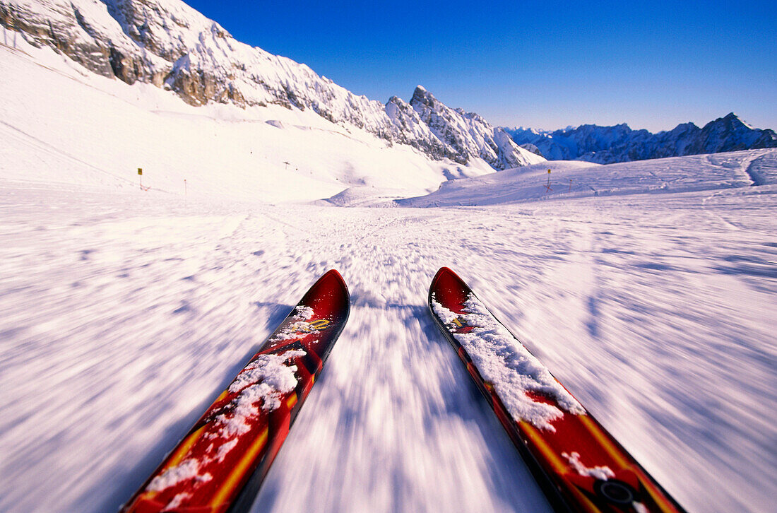 Skis skiing down a ski slope, Zugspitze, Bavaria, Germany, Europe