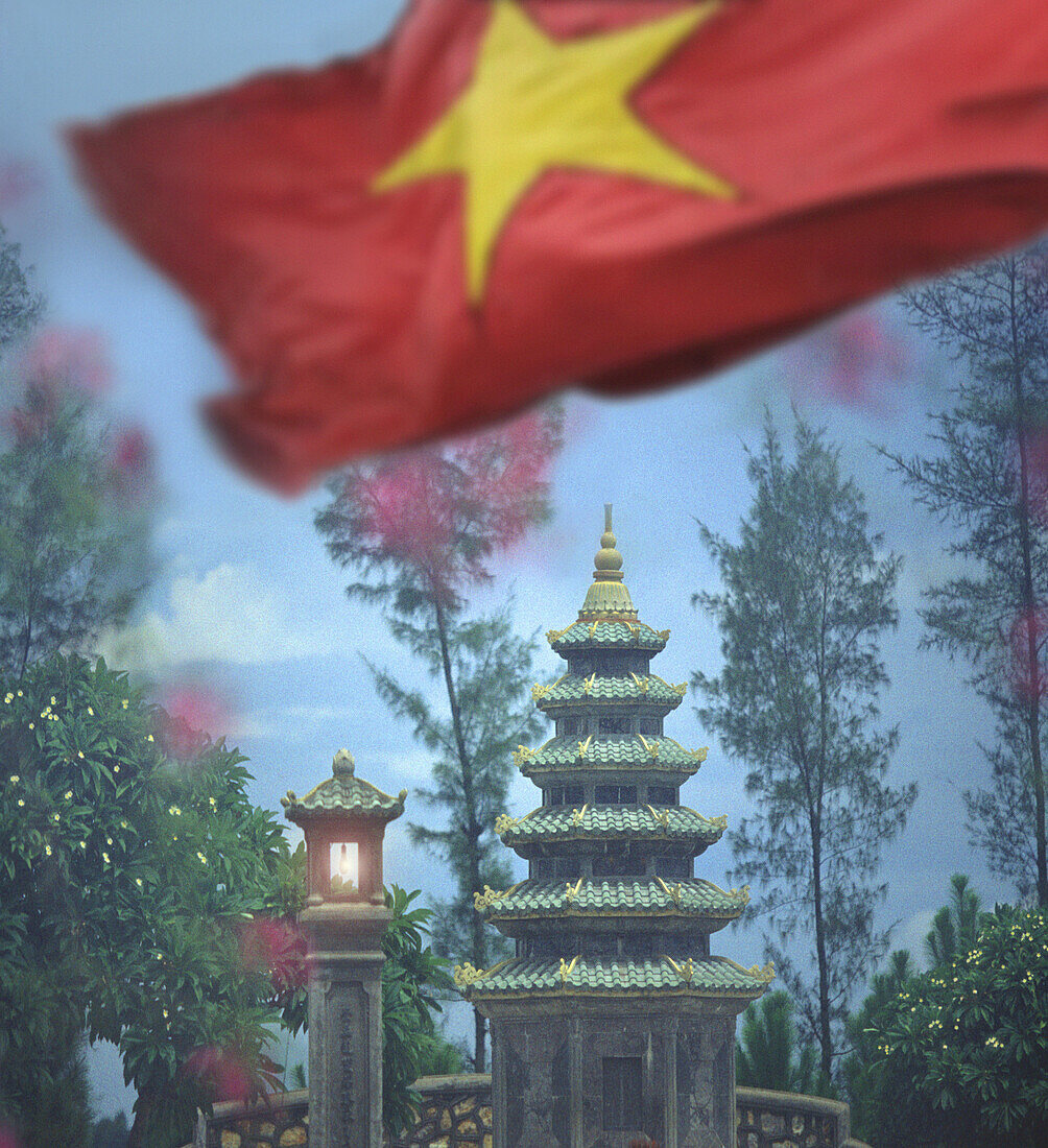 Pagoda in garden of Dai Hung Temple, vietnamese flag, Hue, Vietnam, Indochina