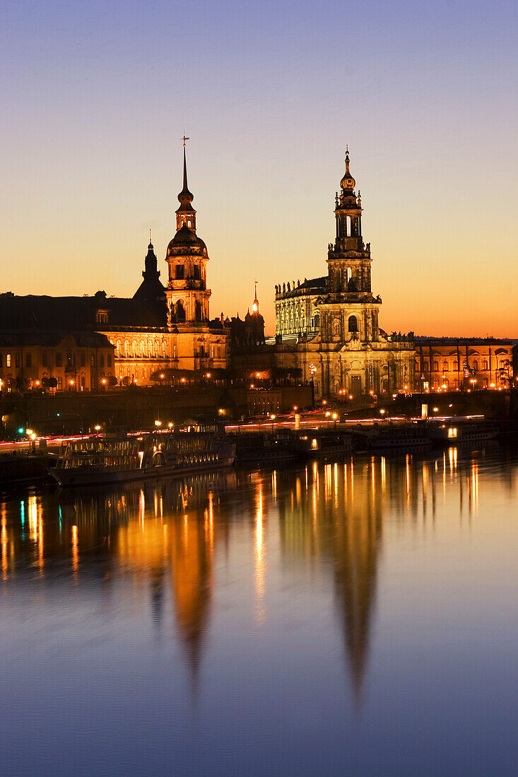 Deutschland, Dresden,Skyline, River Elbe at sunset Hofkirche illuminated