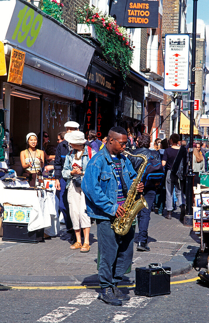 UK , London, Portobello Road, street musician with saxophone