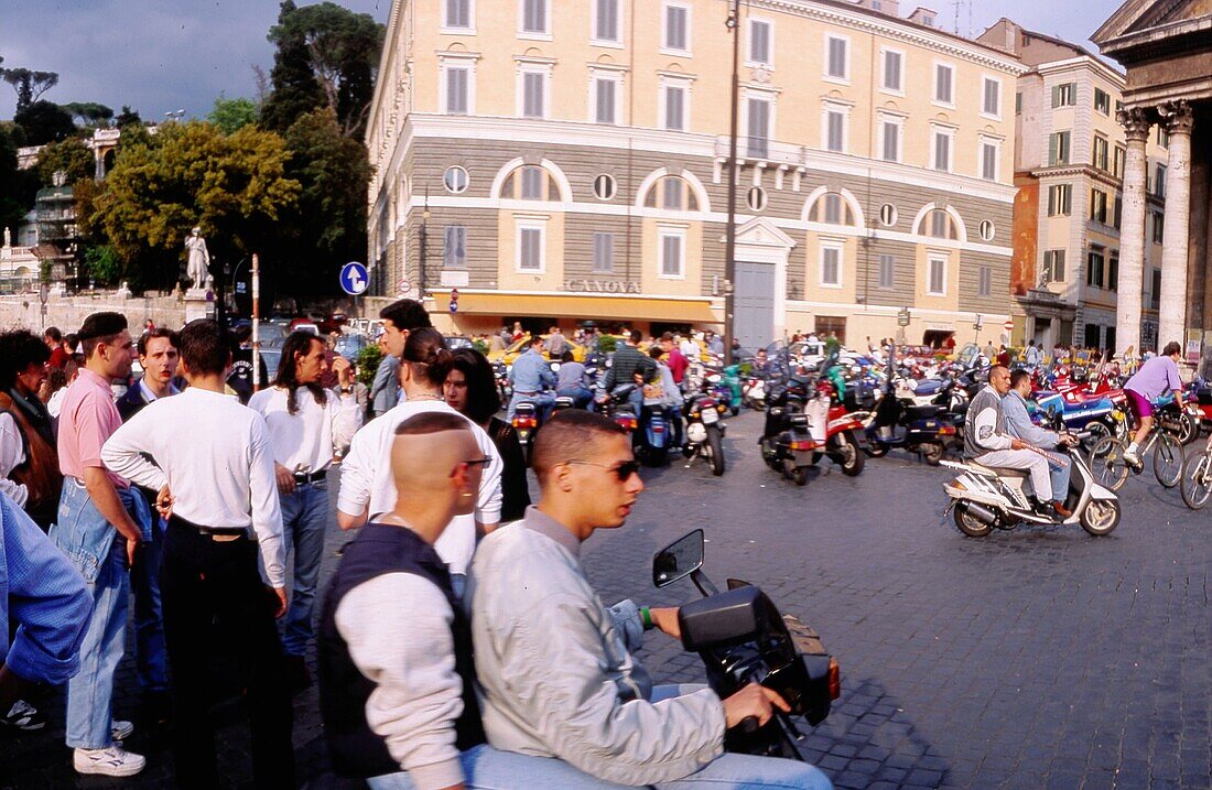 Teenagers on motorbikes, Piazza del popolo, Rome, Italy