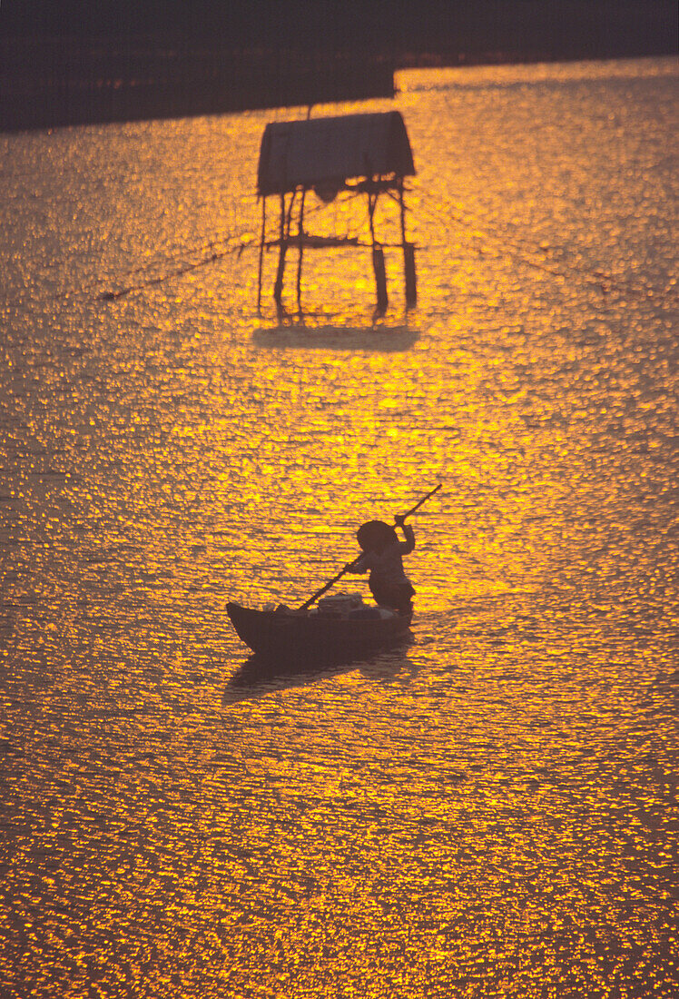 Fishing boat at sunset, rivers delta, Nha Thrang, Vietnam