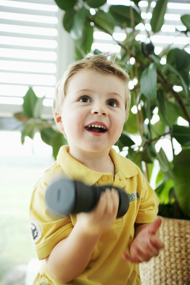 Child lifting a dumbbell