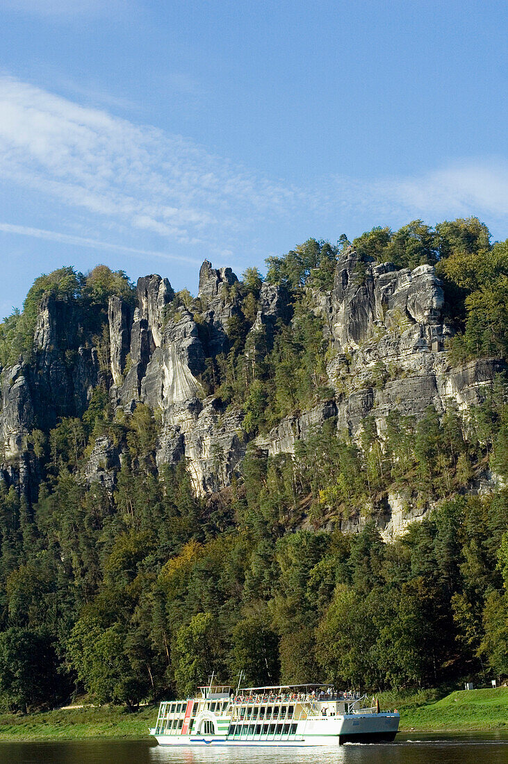 Excursion boat passing Bastein, Elbsandsteingebirge, Saxony, Germany