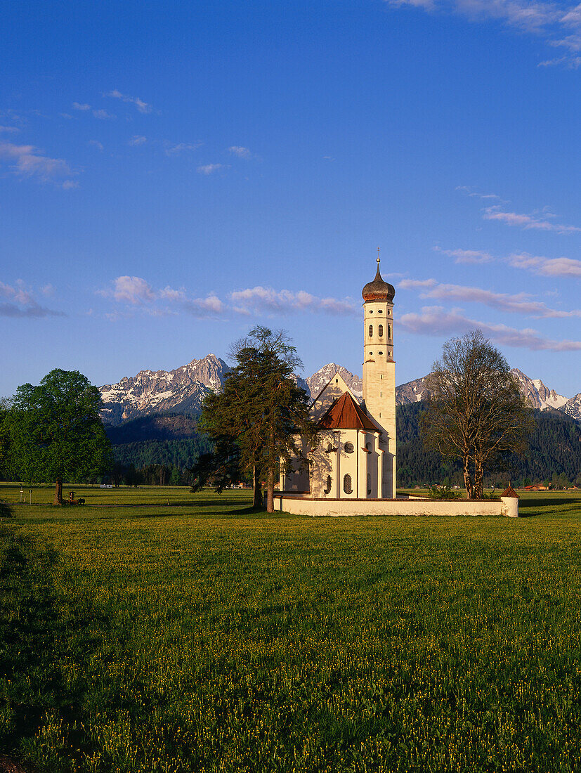 View of St. Coloman with mountains in the background, near Schwangau, Allgeau, Bavaria, Germany