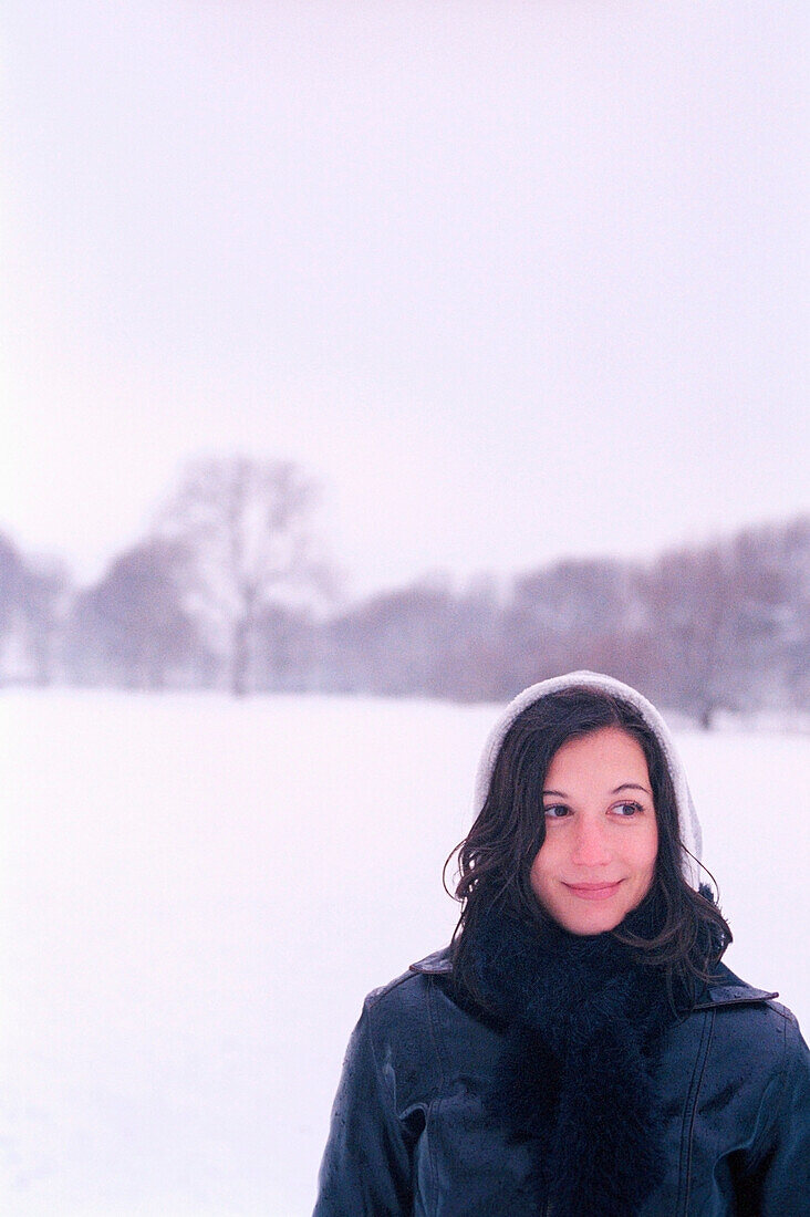 Smiling woman wearing in snow