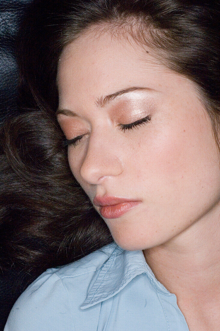 Profile of a young woman with closed eyes