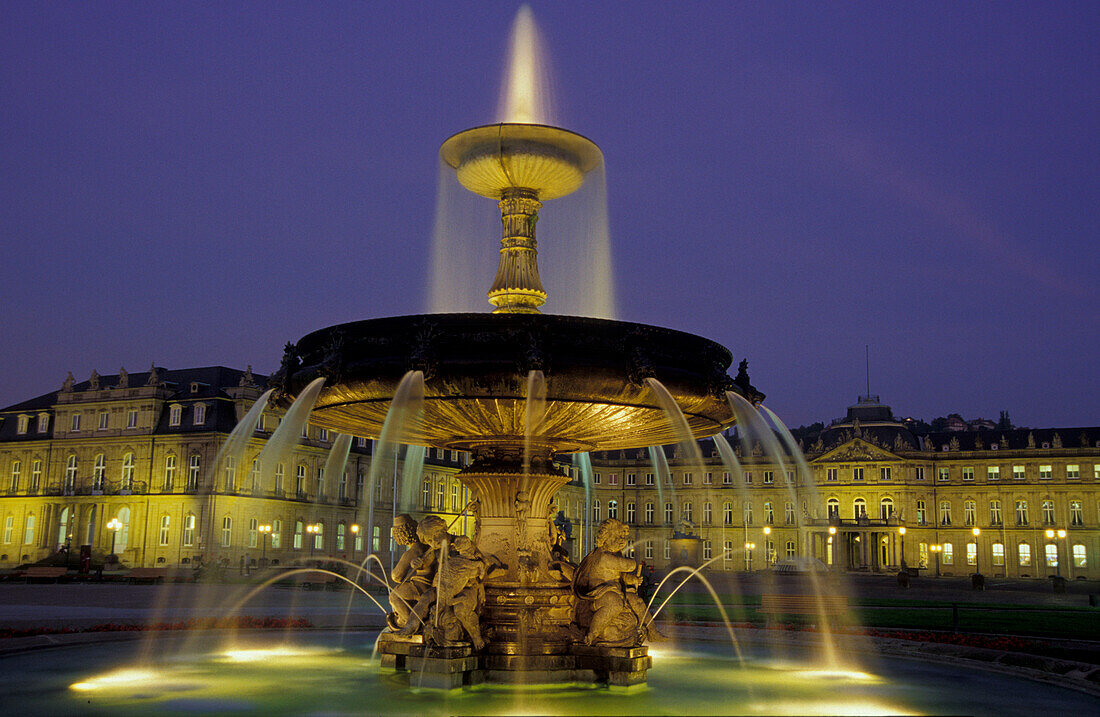 Illuminated fountain at the palace square at night, Stuttgart, Baden-Wuerttemberg, Germany, Europe