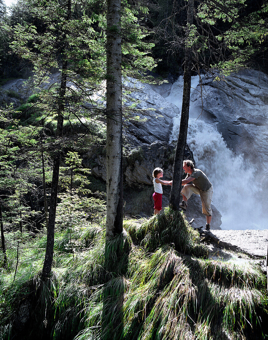 Father and daughter at Simmen Falls, Simmental Vallley, Bernese Alps, Canton of Bern, Switzerland