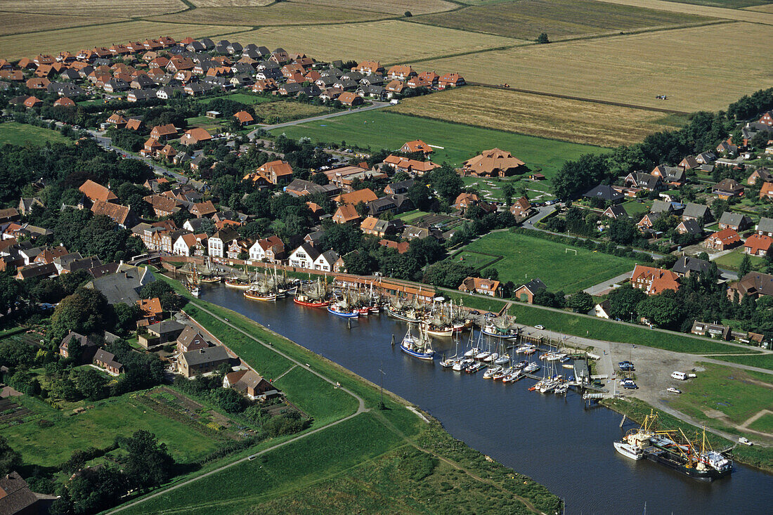 aerial photo of small port of Greetsiel on the river Leybucht in East Frisia, prawn boats, Lower Saxony, northern Germany