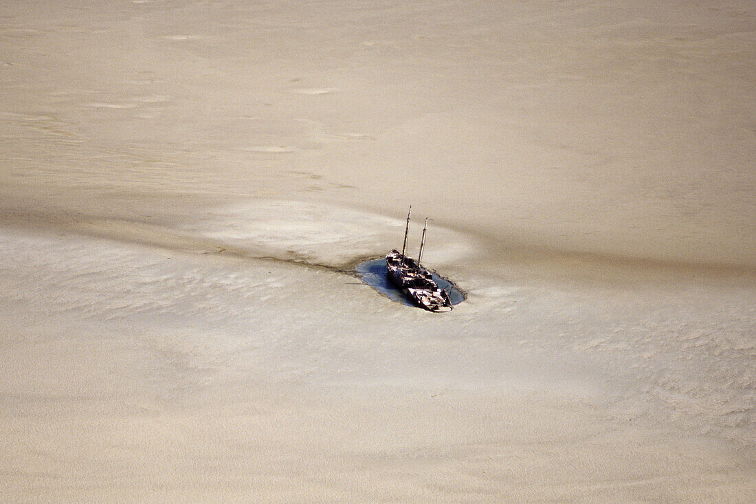 aerial photo of shipwreck on sandbar, mudflat, sandflat, Wadden Sea, German Bight, North Sea, Schleswig Holstein, northern Germany
