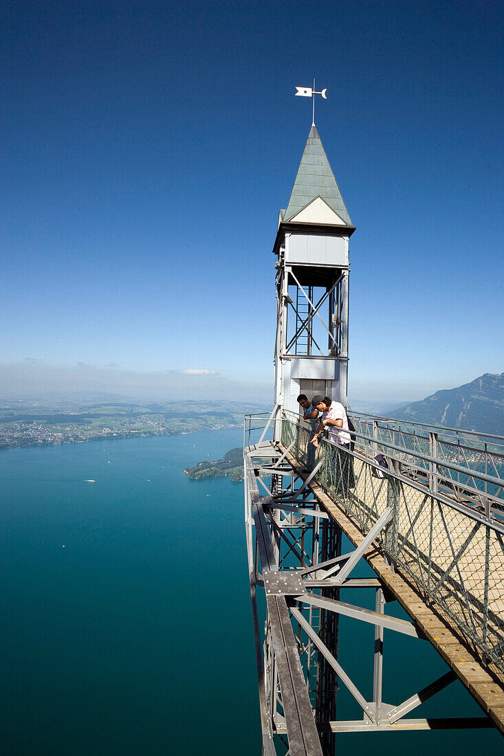 People standing on platform of Hammetschwand Elevator (153 m, highest exterior elevator of Europe) and looking down, Bürgenstock (1128 m), Bürgenstock, Canton Nidwalden, Switzerland