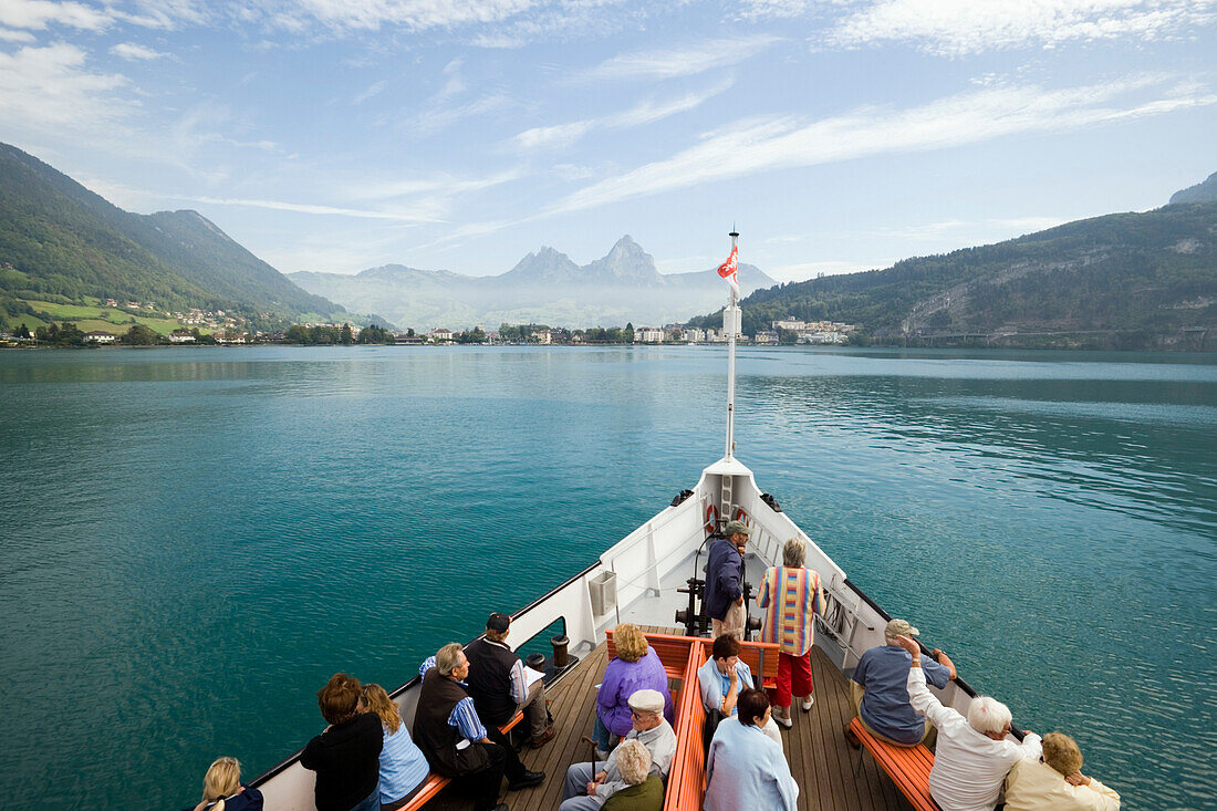 Passengers sitting on the deck of a paddle steamer, Lake Lucerne, Brunnen, Canton of Schwyz, Switzerland