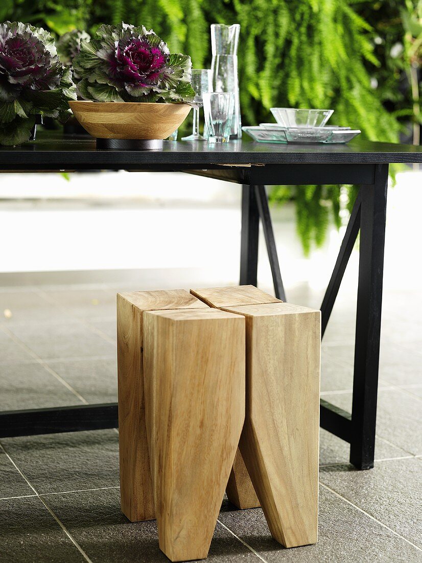 Wooden stool and black table