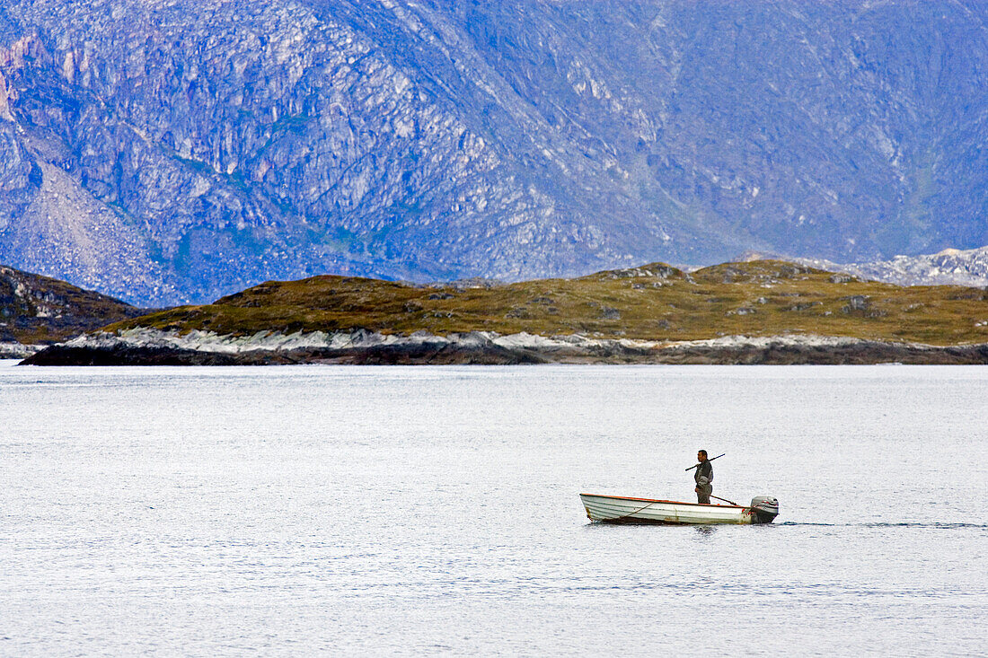 An Inuit, Eskimo on the hunt for seals, at Nuuks coast, Greenland.