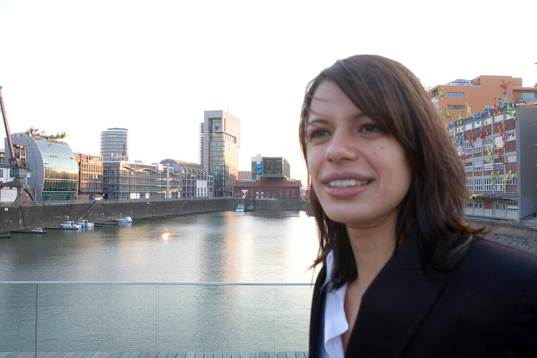 Businesswoman passing, Media Harbor, Dusseldorf, North Rhine-Westphalia, Germany