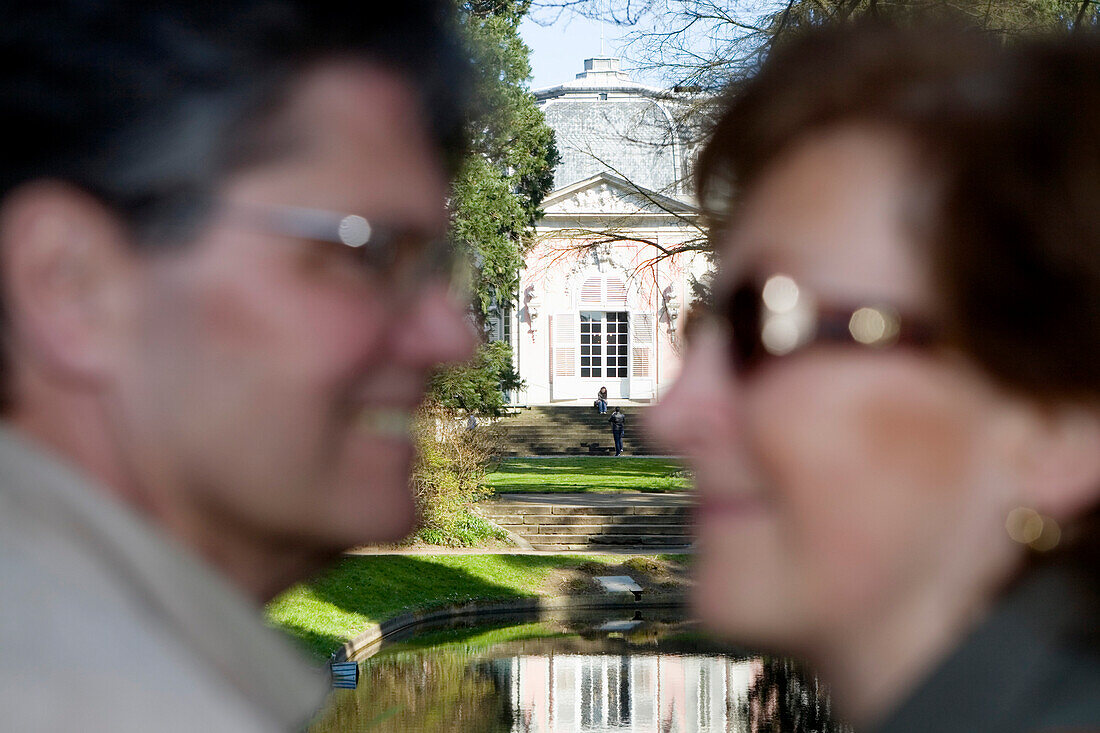 Mature adult couple smiling at each other, Benrath castle, Düsseldorf, state capital of NRW, North-Rhine-Westphalia, Germany