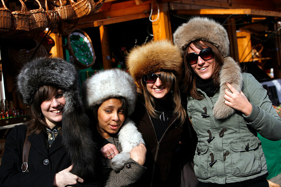 Four young women wearing hats, Budapest, Ungarn