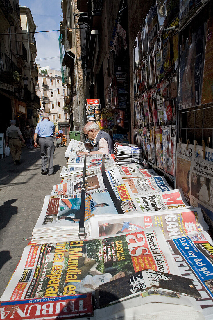 Newspaper stand and seller, Barrio del Carmen Valencia, Spain