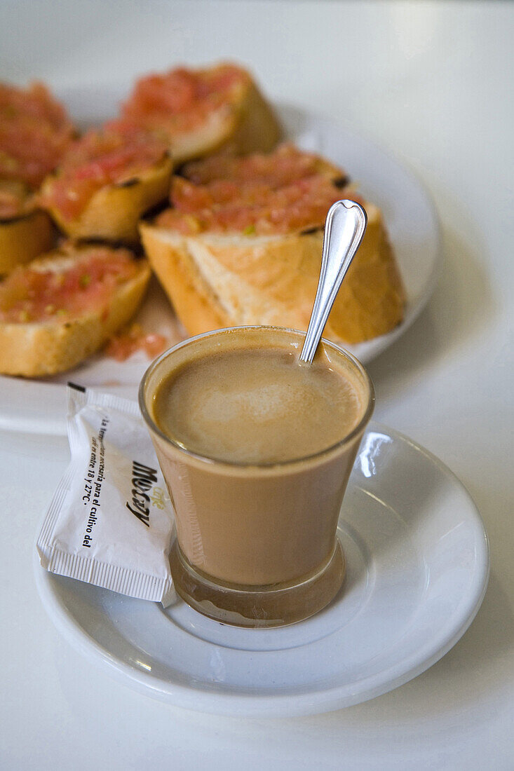 Espresso coffee with milk in a glass, a cortado, Valencia, Spain