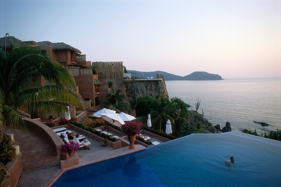 Pool area of a small luxury hotel, La Casa que canta Zihuatanejo, Mexico, America