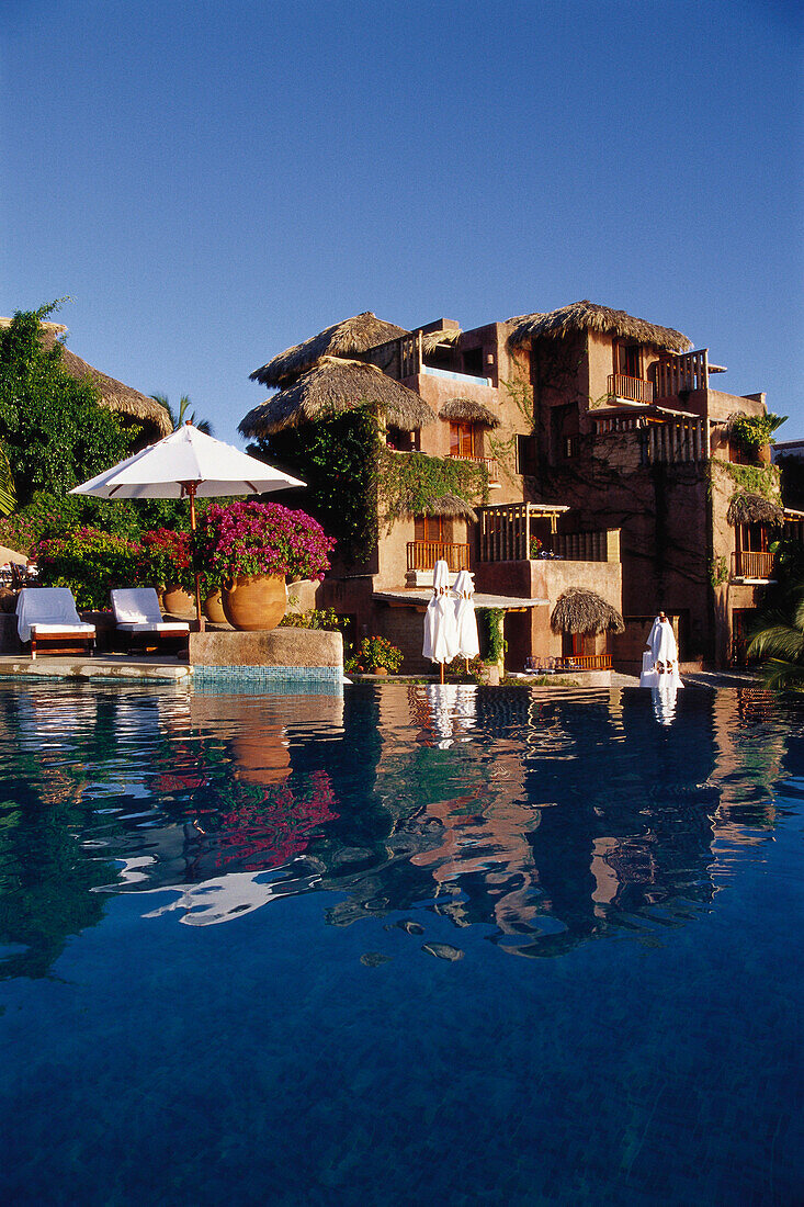 Small luxury hotel and reflection in Pool, La Casa que canta Zihuatanejo, Mexico, America
