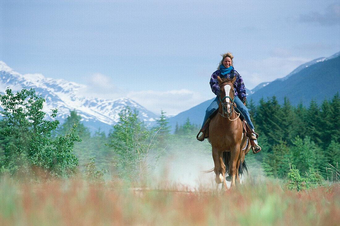 Woman riding a horse, Dyea Valley near Skagway, Alaska, USA