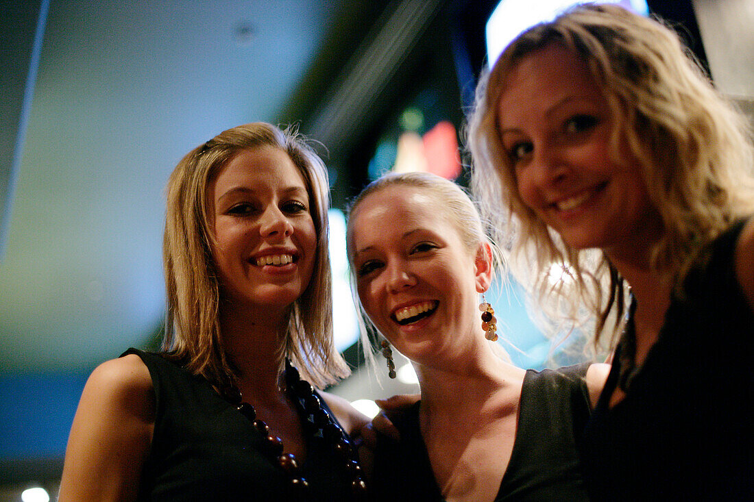 Three young waitresses in a pub, Saltlik, Banff, Alberta, Canada