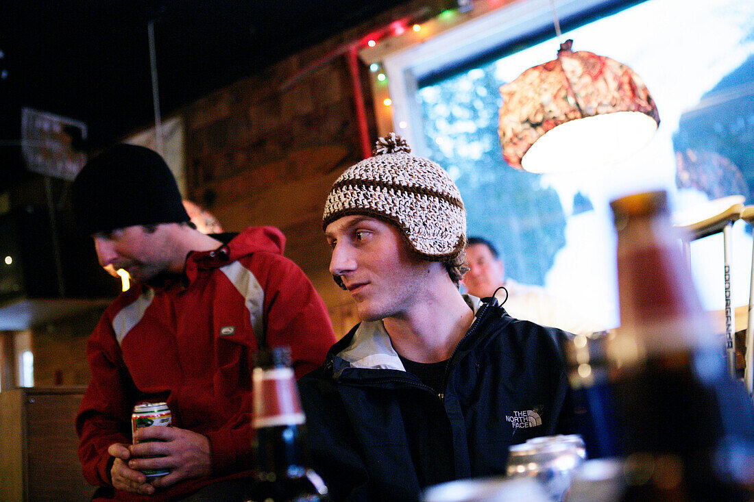 Skiers drinking beer in a pub, T-Bar, Apres Ski, Castle Mountain Ski Resort, Southern Alberta, Canada