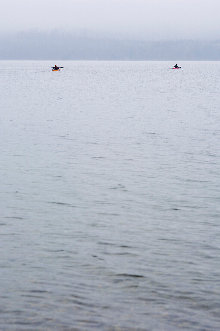 Two canoes on Lake Starnberg, Bavaria, Germany