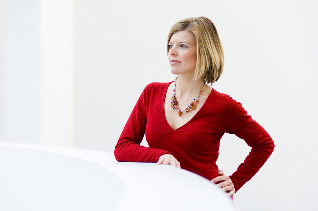 Mid adult woman standing at balustrade