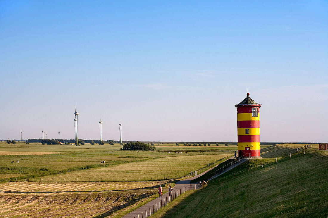 Pilsum Lighthouse on dyke, Pilsum, East Frisia, Lower Saxony, Germany