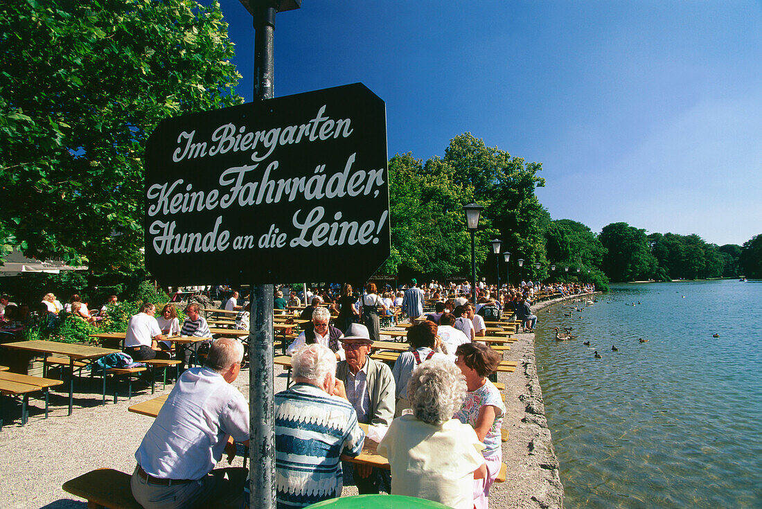 People sitting in beergarden Seehaus, English Garden, Munich, Bavaria, Germany