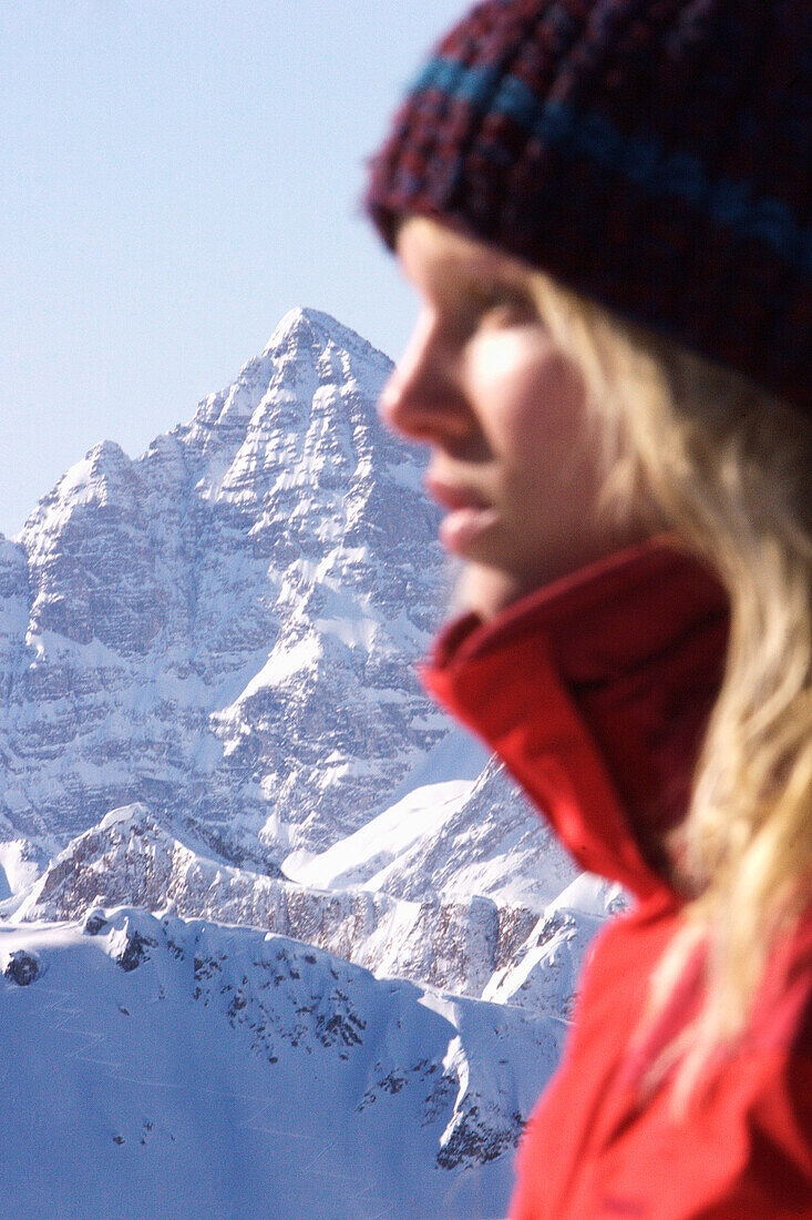 Reflective young woman looking at view, mount Rohnenspitze, Tannheim Valley, Tyrol, Austria