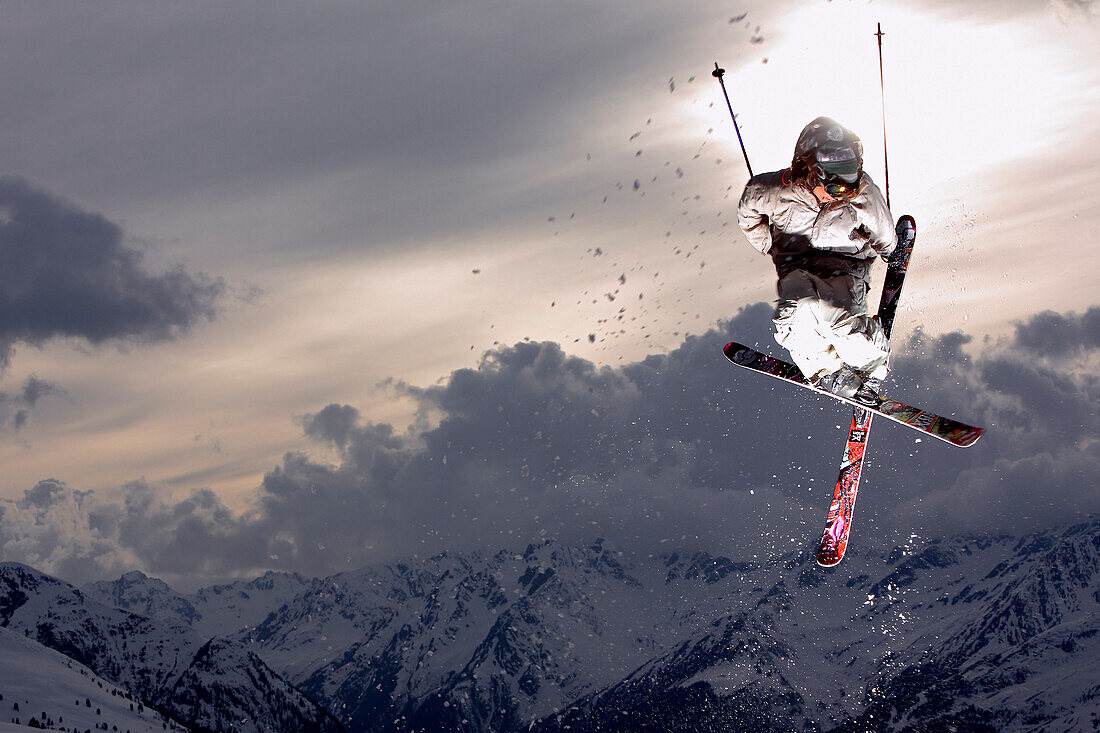 Skier jumping in the sunset, See, Tyrol, Austria