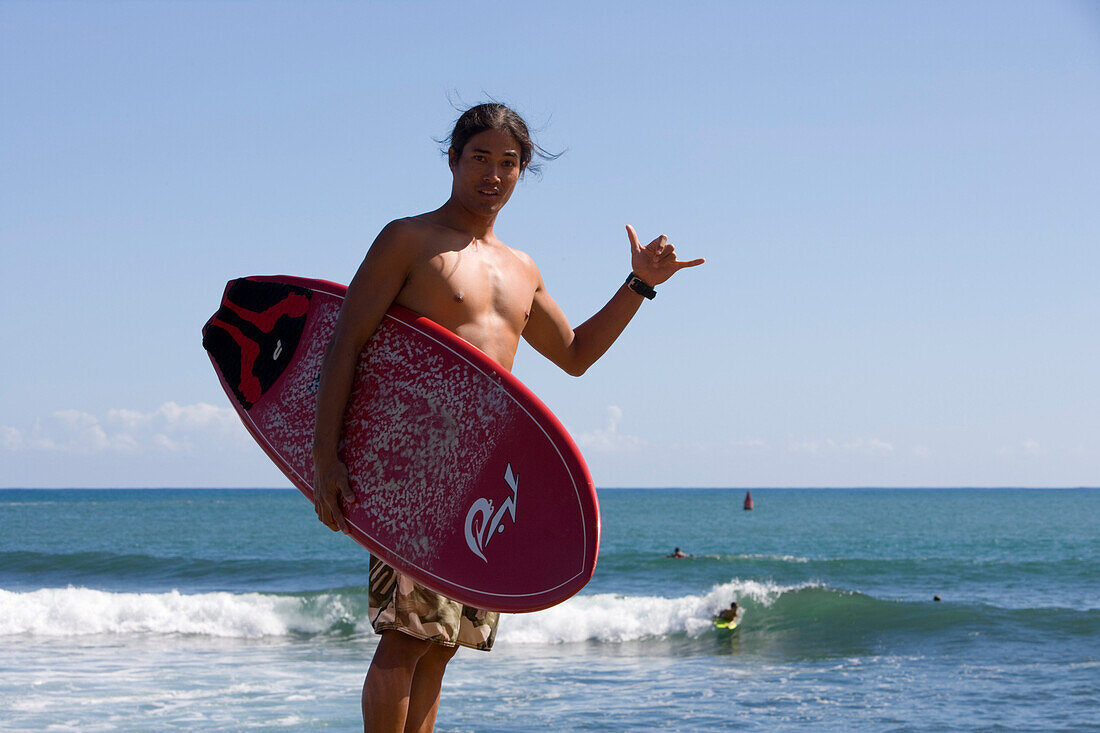 Boy with surfboard, Boogieboard, Boogieboarder, Nawiliwili Beach Park, Lihue, Kauai, Hawaii, USA