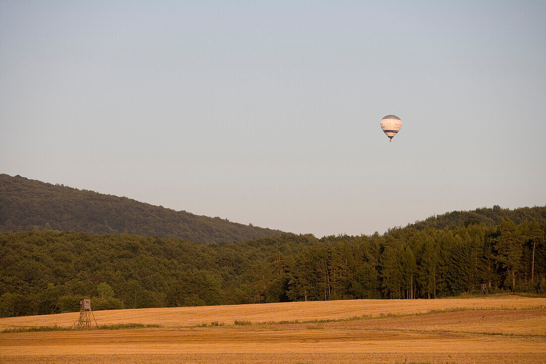 Hot air balloon over Thuringian Landscape, Near Merkers, Rhoen, Thuringia, Germany