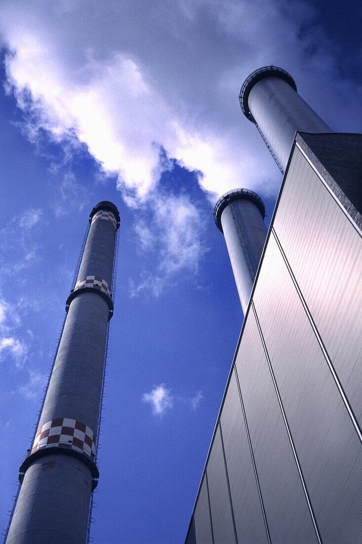 Chimneys emitting smoke from cogeneration plant, Berlin, Germany