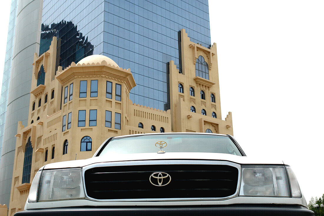 Car in front of Barzan Tower, Doha, Qatar