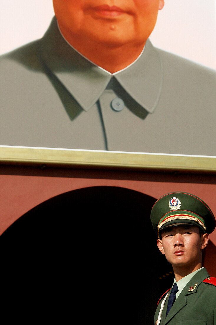 Soldier in front of Mao portrait, Beijing, China